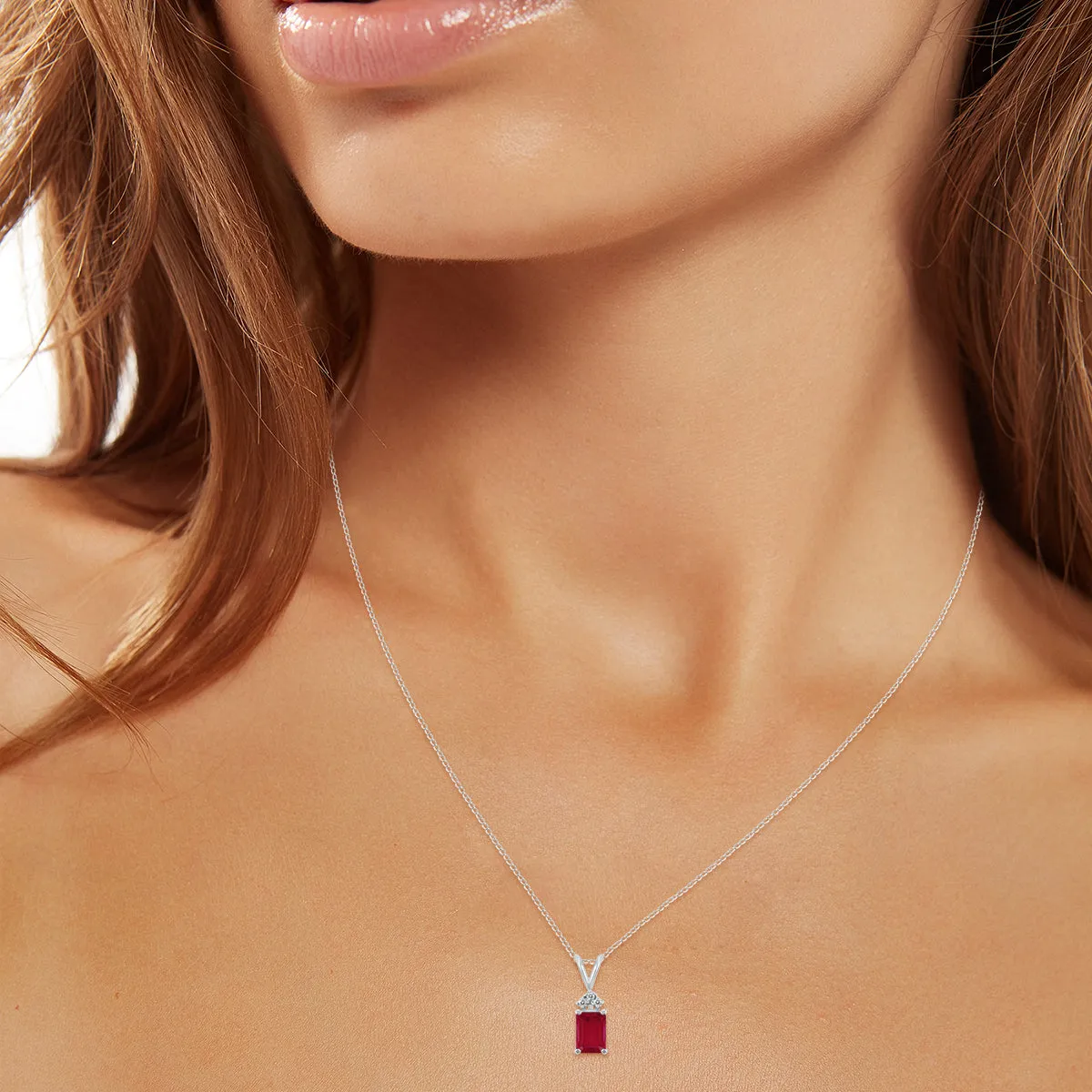 14K White Gold 6X4Mm Emerald Shaped Ruby And Three Stone Diamond Pendant