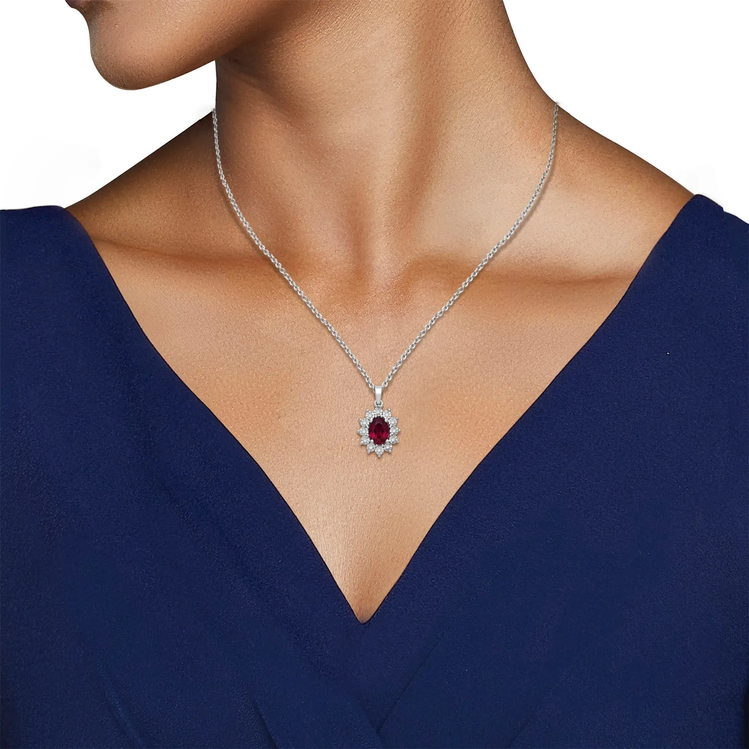 Jewelili Sterling Silver 7x5 MM Oval Created Ruby and 1/20 Cttw Natural White Round Diamond Pendant Necklace