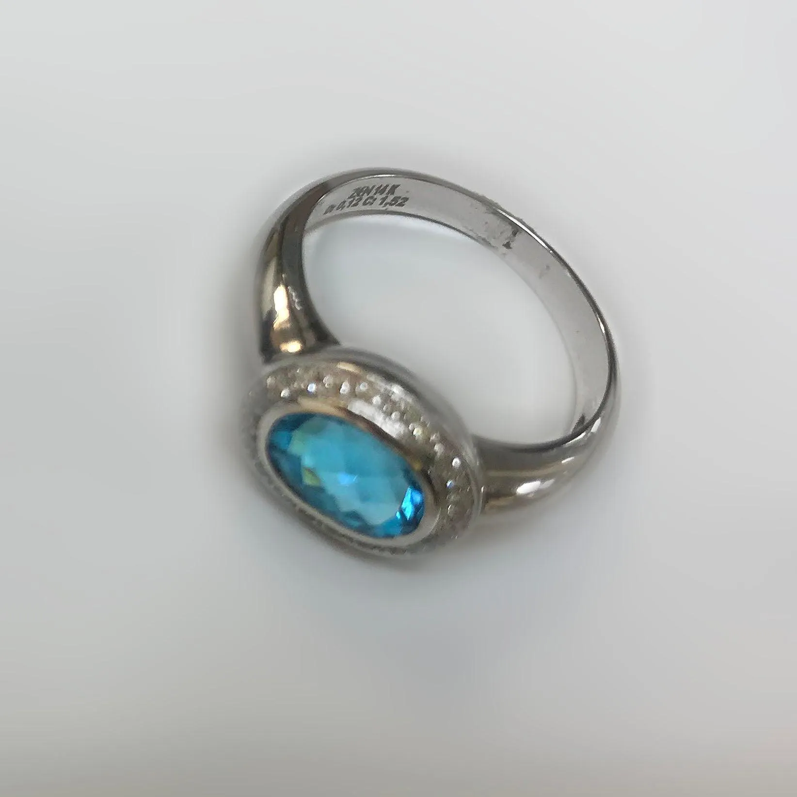 Oval Blue Topaz Ring with Diamonds