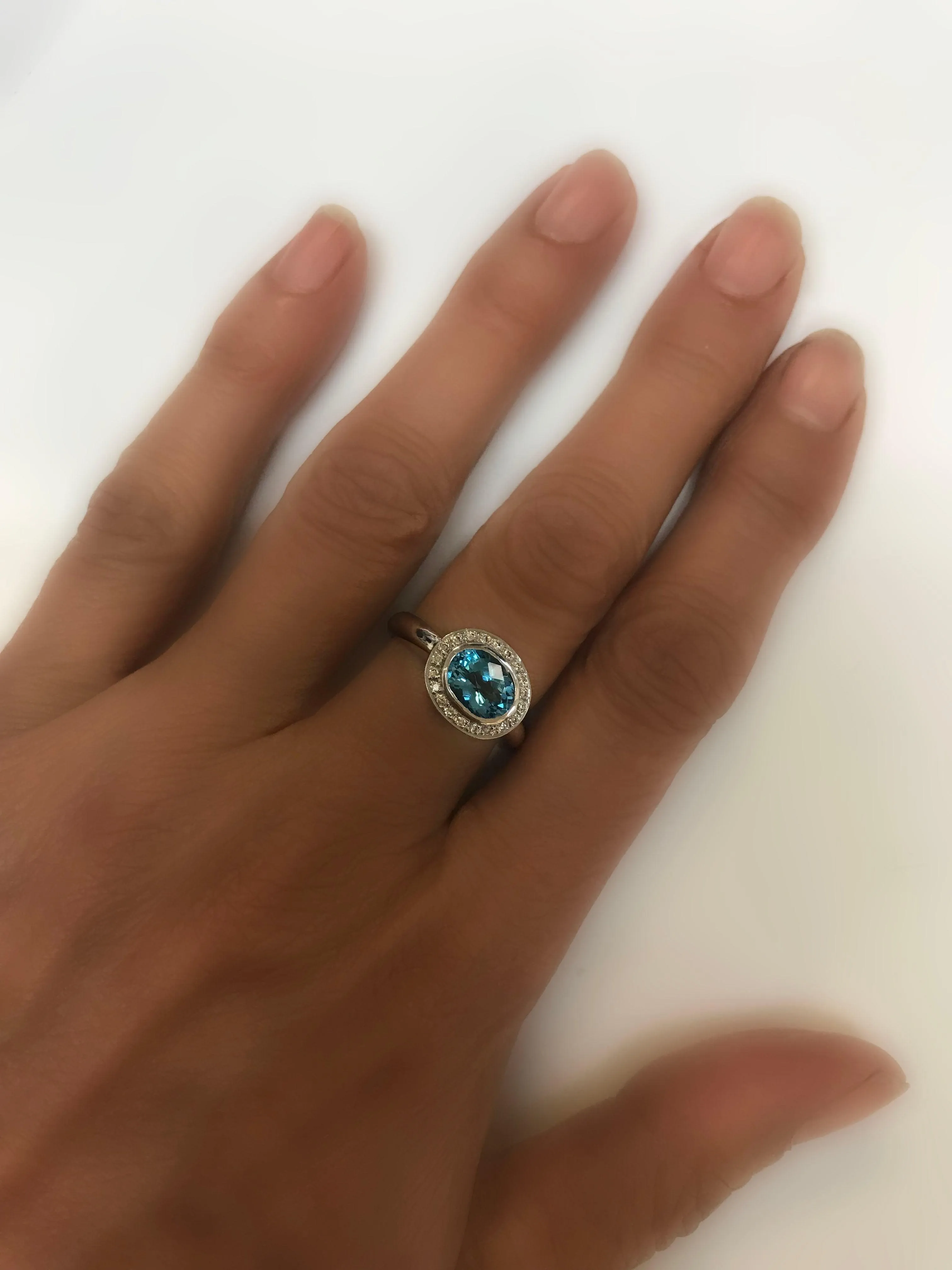 Oval Blue Topaz Ring with Diamonds